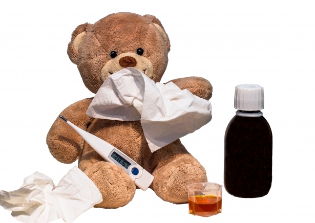 Stuffed bear with tissue, thermometer and medicine bottle